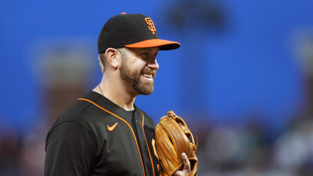 SF Giants third baseman Evan Longoria smiles while in the field.